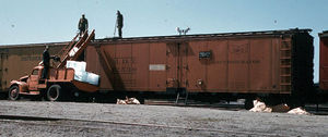 © Photo: Soph Marty An early version of a field icing car loads a Merchants Despatch Transportation Co. reefer (bearing the herald of the GM&O) in Norfolk, Virginia in April 1955.